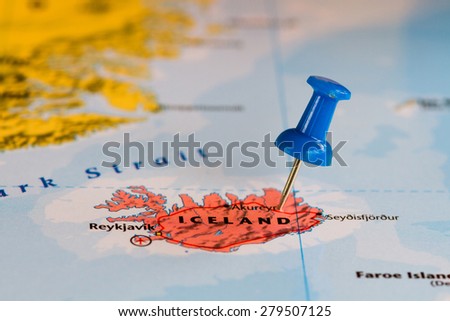 Map of Iceland with a blue pushpin stuck Royalty-Free Stock Photo #279507125