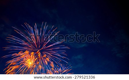 4th July fireworks. Fireworks display on dark sky background. Royalty-Free Stock Photo #279521336