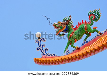 Kylin or Kirin on roof in Chinese temple, Thailand. A symbol of goodness.