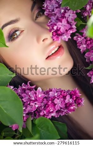 young woman with lilac flowers