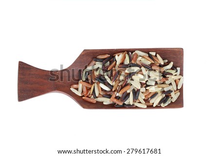 Rice brown brown rice in wooden scoop.