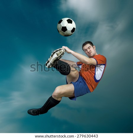 Football player with ball in action outdoors