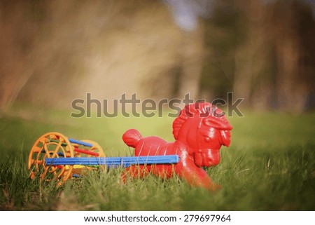 children's rocking horse on the lawn
