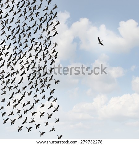 Independent thinker concept and new leadership concept or individuality as a group of flying birds with one individual bird going in the opposite direction as a business icon for innovative thinking.