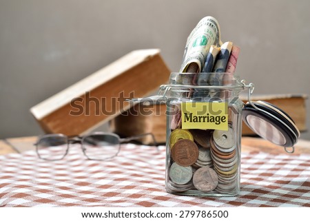 Saving concept for marriage: Conceptual by jar with coin