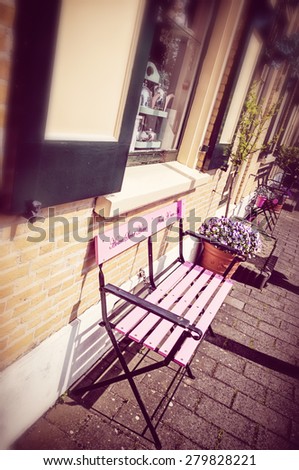 Bench with a sign "Home Sweet Home" in a garden in Holland