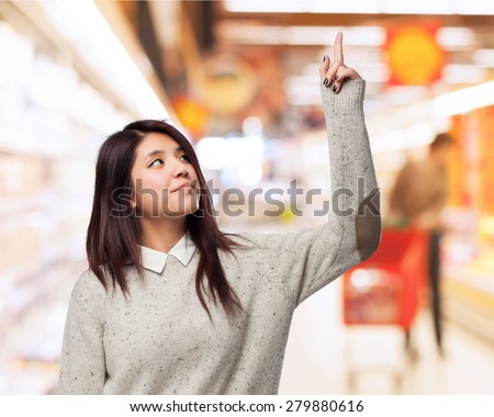 cool chinese-woman pointing-up