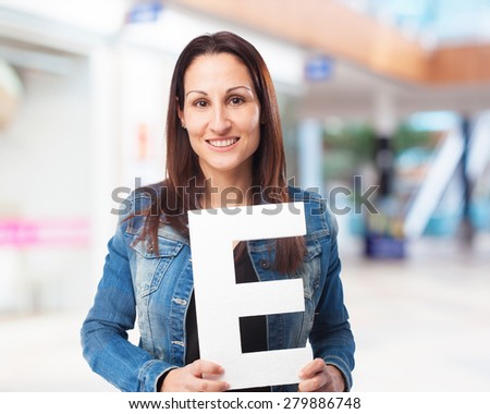 woman holding the E letter