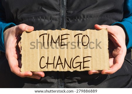 Girl holding a carton paper with text Time to change