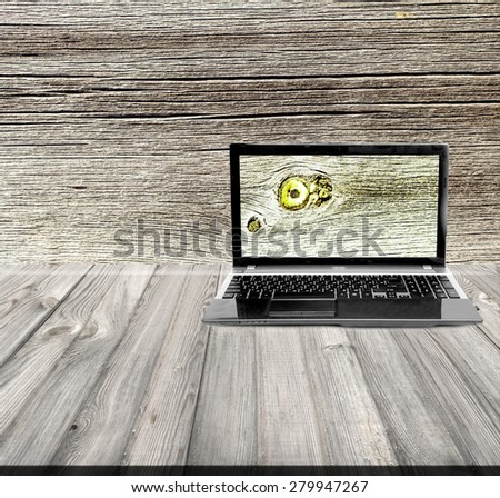 laptop on a wooden background