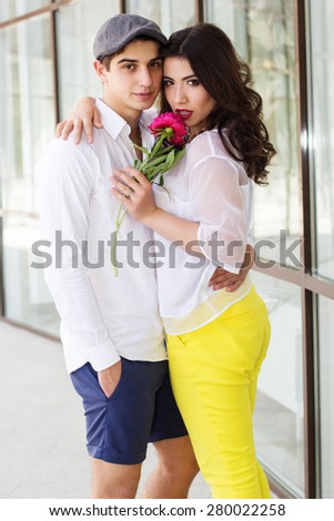 Young fashion hipster couple girl and boy in love in spring sunny weather