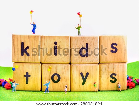 image of mini figure kids dolls hold balloon playing on toys wooden  blocks isolated on white background.