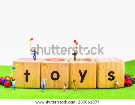 image of mini figure kids dolls hold balloon playing on toys wooden  blocks isolated on white background.
