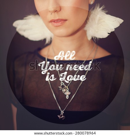 All You Need Is Love card design with white text over blurred portrait of a beautiful girl with little wings on her neck in square format.