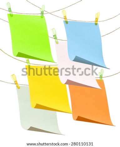 colored cards hanging on a rope on a white background