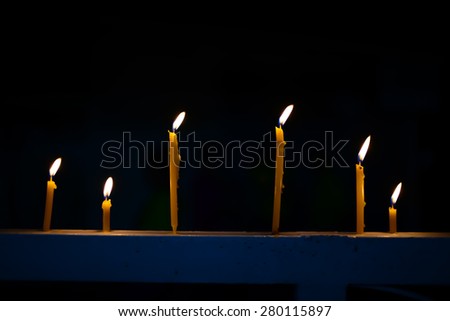 Candles on black background 