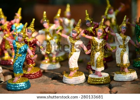 Picture from world heritage Ayutthaya site, Thai women dancing doll that people like to put around Buddha statue or pagoda at Wat Yai Chaimongkol temple in Thailand