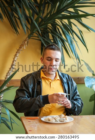 picture of a young man while eating