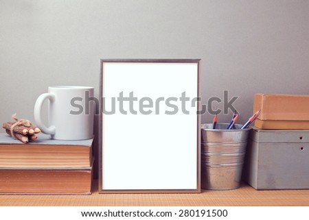 Picture frame mock up template with books and desk objects