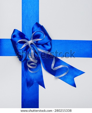 blue bow made from silk on grey