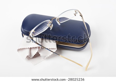 Spectacles , cleaning cloth and blue case Royalty-Free Stock Photo #28025236