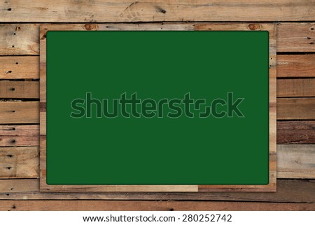 Green board and wood background