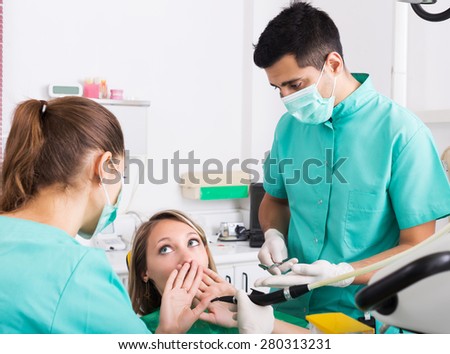 Terrified client and dental clinic crew during check up