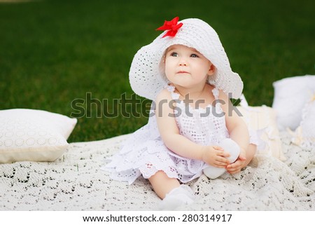 baby girl seating on the grass - summer