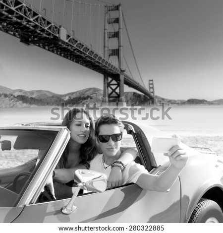 selfie of young teen couple at convertible car in San Francisco Golden Gate Bridge photo mount