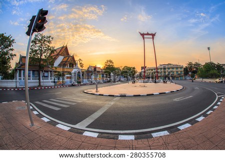 The Giant Swing with Temple of Buddha at Twilight Time with Fish-eye lens (Bangkok, Thailand)