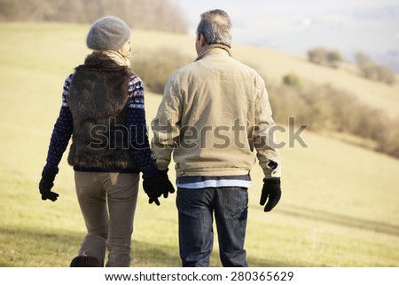 Mature couple on country walk in winter