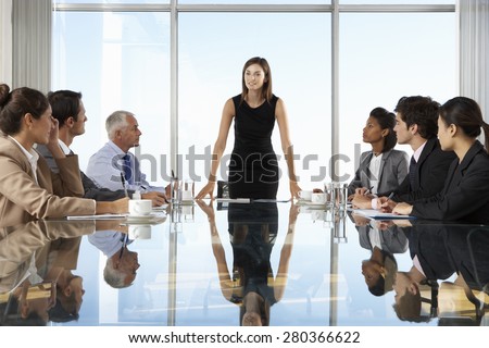 Group Of Business People Having Board Meeting Around Glass Table Royalty-Free Stock Photo #280366622