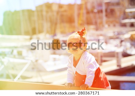 cute little girl portrait in the port, kids travel