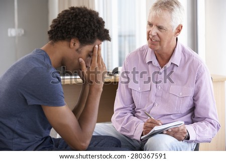 Young Man Having Counselling Session Royalty-Free Stock Photo #280367591