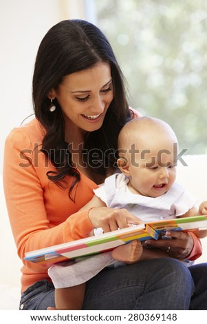 Hispanic mother and baby at home