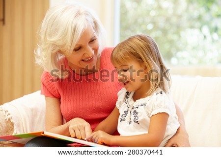 Grandmother and granddaughter reading