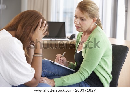 Young Woman Having Counselling Session Royalty-Free Stock Photo #280371827