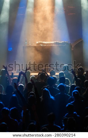 The crowd during a performance dj in a nightclub