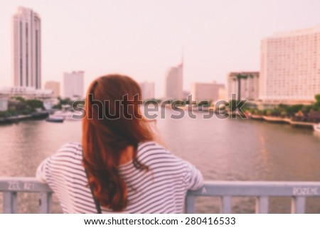 Blurred background : a girl on the bridge with vintage filter