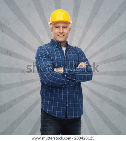 repair, construction, building, people and maintenance concept - smiling male builder or manual worker in helmet over gray burst rays background