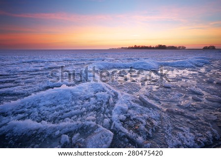 Winter landscape with sunset fiery sky. Composition of nature.

