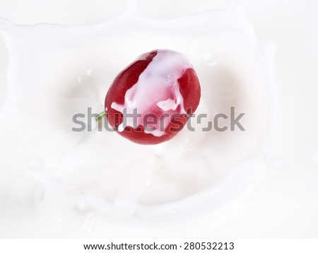 cherry drop into milk