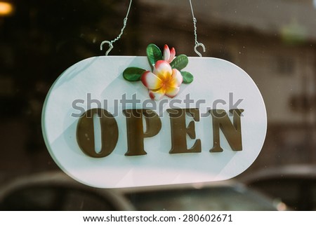 open sign on glass door