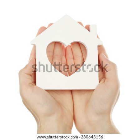 Female hands holding house isolated on white