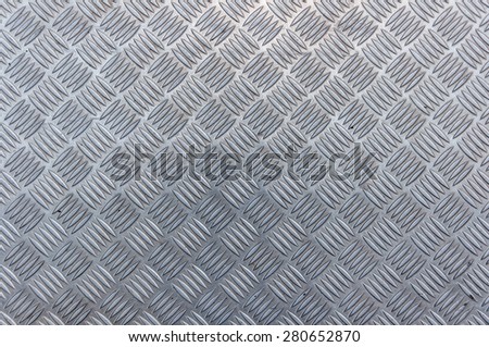 Abstract background of metallic carpet. Seamless steel diamond plate texture.