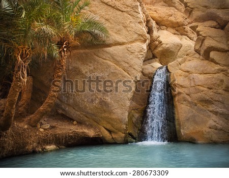 View of mountain oasis Chebika with waterfall, Sahara desert, Tunisia, Africa Royalty-Free Stock Photo #280673309