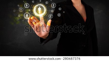Young woman touching future technology social network button
