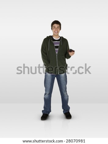 Happy male teen with mobile phone