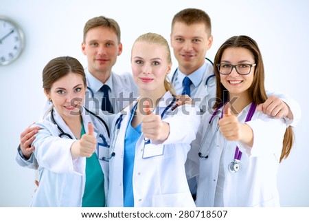 Portrait of doctors team showing thumbs up 
