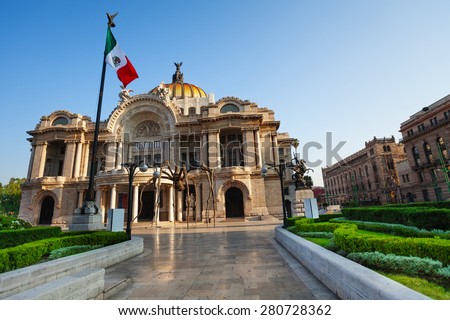 Palace of fine arts facade and Mexican flag on downtown of Mexico capital city Royalty-Free Stock Photo #280728362